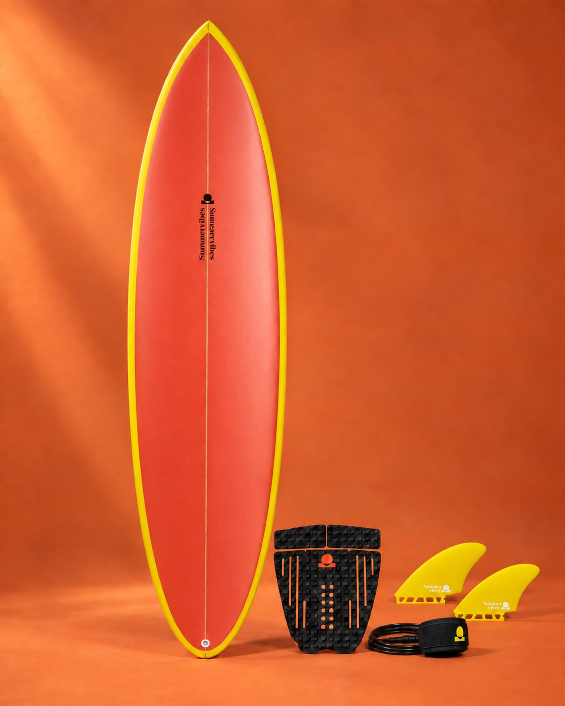 Orange and yellow surfboard with yellow fins and black accessories