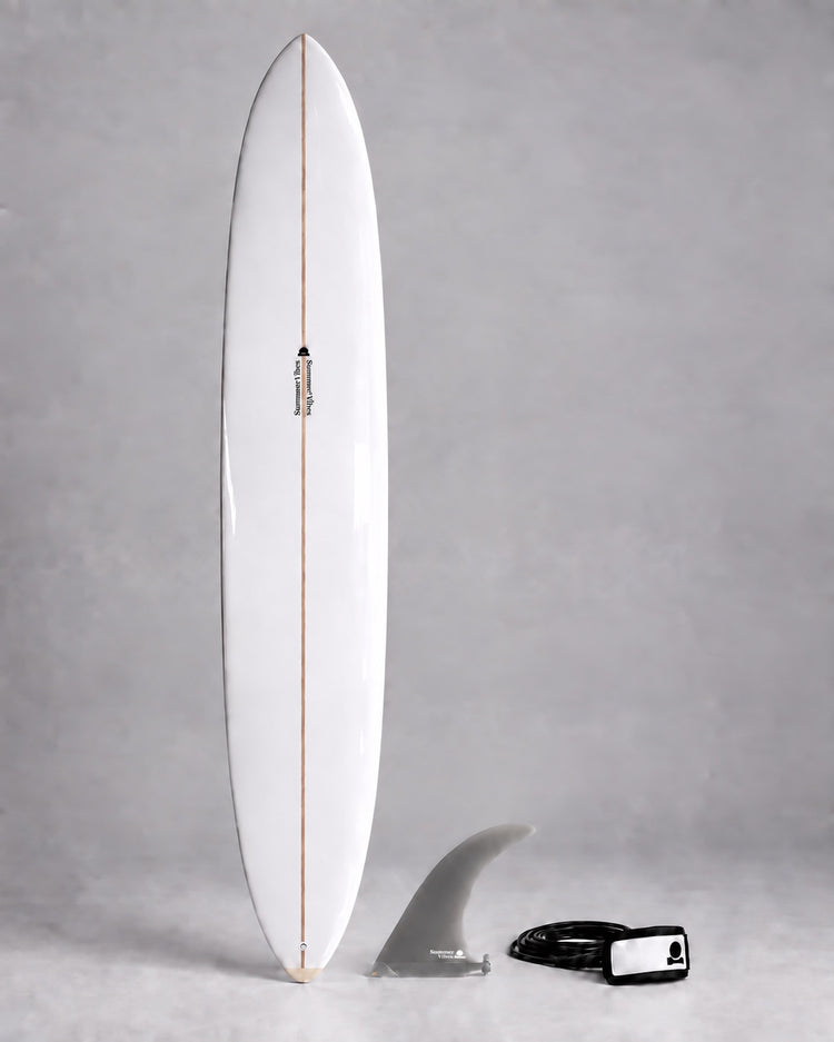 White longboard with grey single fin and black and white leash