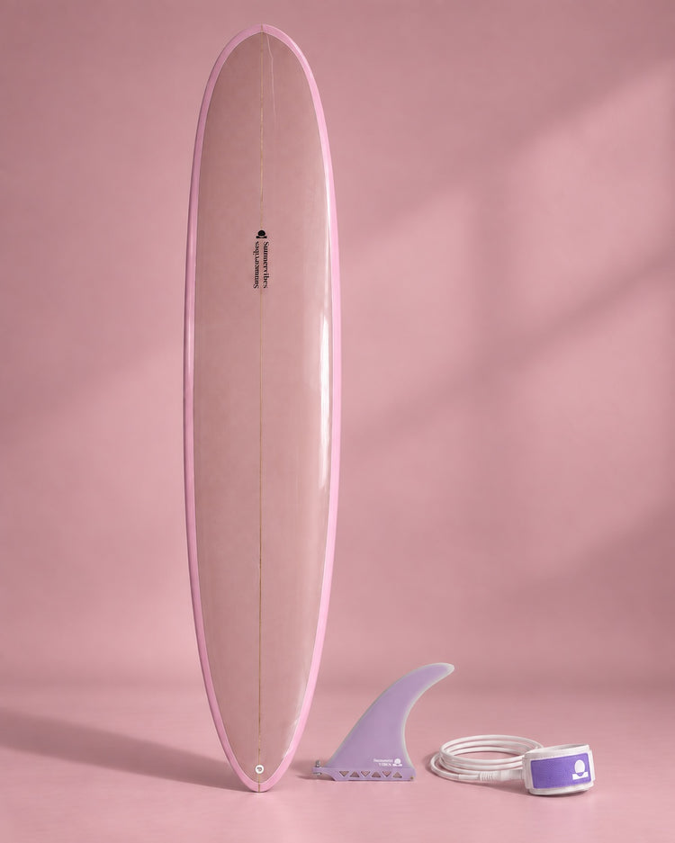 Blush pink longboard with lavender single fin and leash