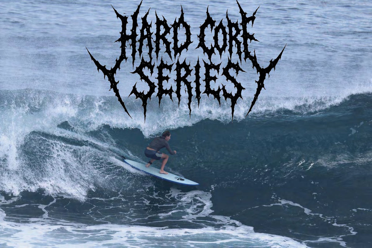 Surfer riding a blue Hard Core softboard deep in a barrel under the Hard Core Series logo