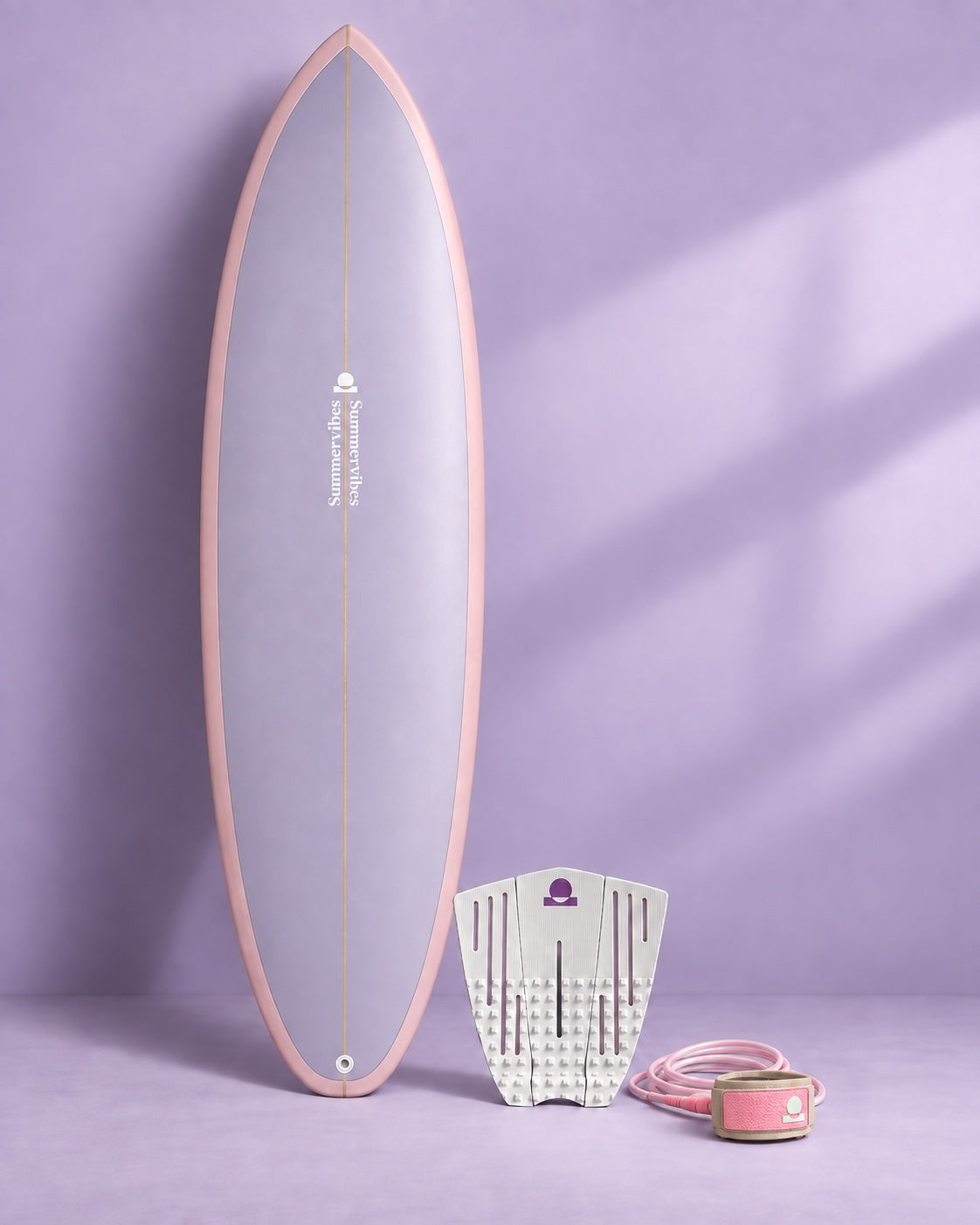 Pink and lilac surfboard with a coordinating leash and white traction pad